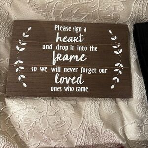 Brown Wooden Sign with White Text